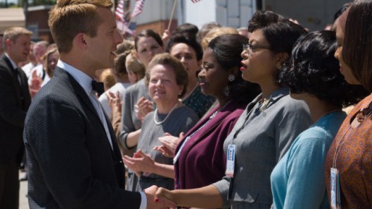 DF-04856_R2 - Katherine G. Johnson (Taraji P. Henson), flanked by fellow mathematicians Dorothy Vaughan (Octavia Spencer) and Mary Jackson (Janelle Monáe) meet the man they helped send into orbit, John Glenn (Glen Powell), in HIDDEN FIGURES. Photo Credit: Hopper Stone.